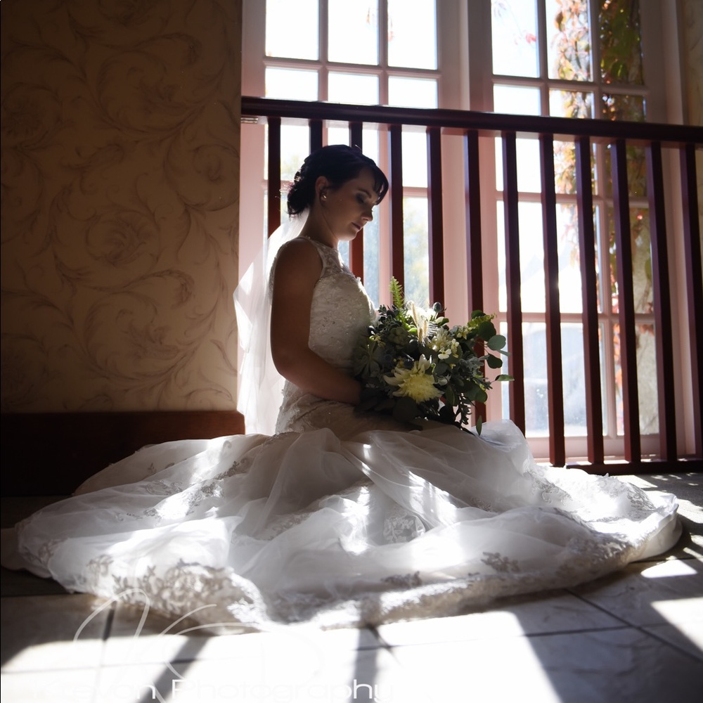 Beaded Lace Wedding Dress with Illusion Neckline & Intricate Floral Embroidery.